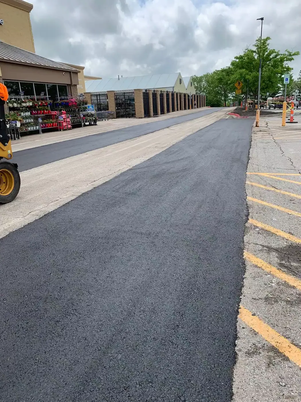 Weathered commercial asphalt showing freeze-thaw damage in Odessa, MO