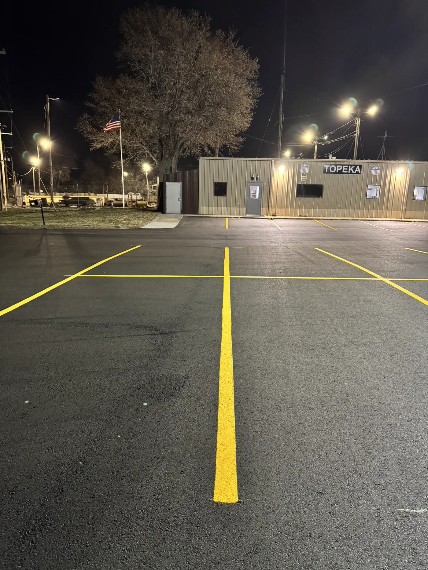 Asphalt milling in progress at Union Pacific Railroad parking lot in Topeka, Kansas