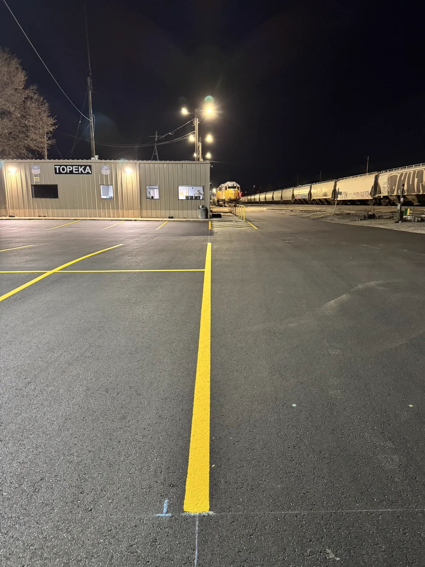 Close-up of fresh asphalt surface at Union Pacific Railroad facility, Topeka Kansas