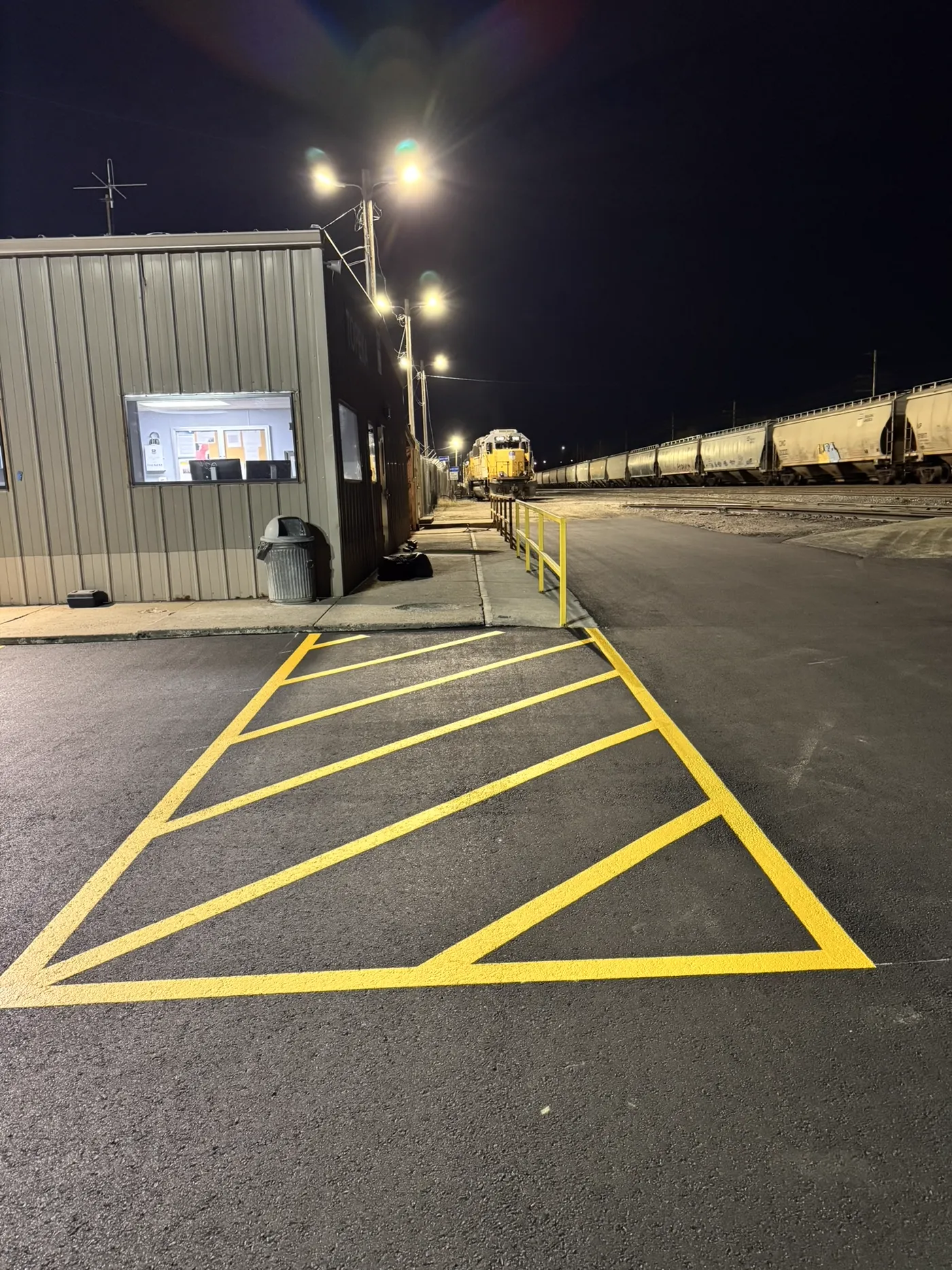 Platinum Paving crew compacting asphalt overlay at Union Pacific Railroad Topeka